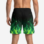 Opposite side view of custom black and green basketball shorts with full sublimated flame pattern and small side split at hem