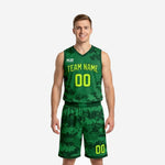 Custom green basketball uniform with digital camo pattern and neon lime team name and number, front view of full 2-piece set