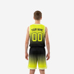 Opposite side view of neon green and black youth basketball uniform set showing white chevron hem detail on shorts