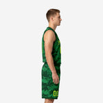 Side view of custom green basketball uniform showing digital camo jersey and matching shorts with neon lime number on leg