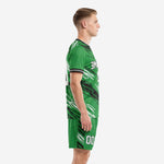 Men's custom green soccer kit side view showing scratch graphic on jersey and shorts