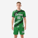 Custom green and black soccer uniforms with diagonal scratch pattern sublimation, front view