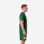 Sublimated green soccer uniforms left side view showing neon yellow sleeve accent stripes and shorts leg stripe detail