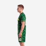 Custom forest camo soccer uniform right side view displaying full-dye sublimation print coverage on jersey and matching shorts