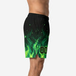 Side panel detail of custom neon green flame basketball shorts showing gradient from yellow-green hem to solid black upper leg with spark detail