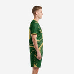 Men's custom green soccer uniform side view showing Athletic Gold marble swirl pattern on jersey and shorts