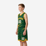 Opposite side view of custom green and gold youth basketball uniforms showing gold armhole binding and matching shorts design