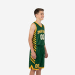 Custom green and gold youth basketball uniforms showing diagonal gold stripe side panels on jersey and shorts, youth boy model, side angle view