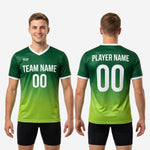 Sleeve cuff detail on custom green soccer training jersey showing white contrast trim and gradient fade