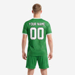 Detail view of custom green soccer jersey and shorts set with white v-neck collar and ribbed cuffs