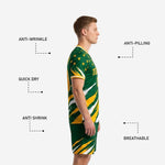 Custom green soccer shorts with Athletic Gold and White slash-burst print and player number on left leg