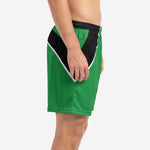 Custom green soccer shorts side view showing black diagonal contrast panel and white trim line on adult male model