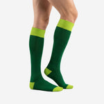 Custom green soccer socks showing Forest Green over-the-calf body and Lime Green contrast cuff, side view