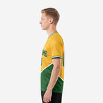 Green soccer team jersey right-side view displaying Kelly Green lower colorblock panel and white contrast sleeve cuff trim on male model