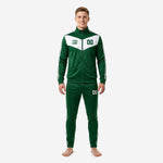 Custom green soccer tracksuit in forest green and white with chevron chest panel, team logo, and player number, front view on male model