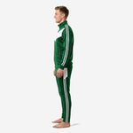 Forest green and white custom soccer tracksuit side profile view showing stand collar, full-zip jacket, and matching tapered pants