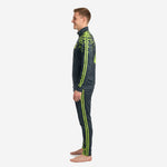 Men's custom green soccer tracksuit right side profile showing tapered pant leg with neon green stripes and pixel detail at ankle