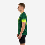Back view of custom green soccer training jersey with player surname and back number printed in Neon Yellow