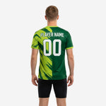Custom green soccer training jersey close-up of diagonal Lime Green brush-stroke graphic panel across the right chest and shoulder