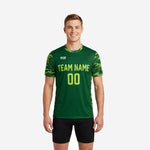 Custom green soccer training jersey in Forest Green with Neon Green camo sleeves, chest team name and number print, front view on male model