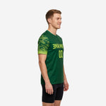 Green soccer training jersey side view showing Neon Yellow gradient camo-dot sleeve print and Forest Green body