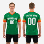 Full body view of custom Kelly Green and orange soccer training jersey on male model, showing athletic cut and all print zones