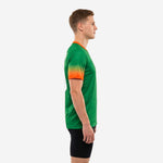 Full print custom green soccer training jersey showing Kelly Green body and orange gradient sleeve fade, left side profile view