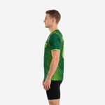 Custom green soccer training jersey right side view showing back player name and number in neon green sublimated print, geometric stripe pattern continuing across back panels