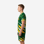 Green soccer uniform side view right angle showing full-dye sublimated Forest Green kit with Gold star scatter on shoulders