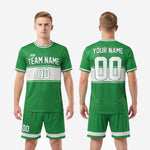Custom green soccer uniforms full kit back view showing player name and number on Kelly Green sublimated jersey