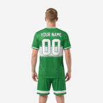 Custom green soccer uniform shorts detail showing Kelly Green fabric and white hex-panel hem trim