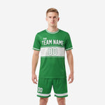 Custom green soccer uniforms in Kelly Green and white with hex-panel design, front view on adult male model