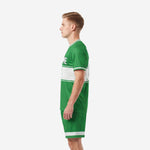 Custom green soccer uniform Kelly Green jersey and shorts with white hex-panel band, right side view on adult male model