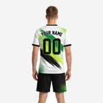 Close detail of custom green soccer uniforms brush-stroke sublimation print across jersey chest and front number zone