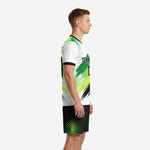 Custom green soccer uniforms left side view displaying Kelly Green diagonal print panels and black contrast trim
