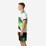 Custom green soccer uniforms right side view showing neon yellow-green brush-stroke design and black halftone shorts