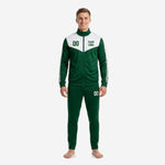 Custom green and white soccer tracksuit with chevron chest panel, front view on adult male model