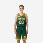 Custom green youth basketball uniforms with gold halftone dot fade jersey and matching shorts, front view on youth boy model