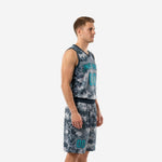 Side view of custom grey and teal digital camo basketball uniform set showing V-neck jersey and matching shorts on male model