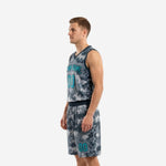 Right side view of grey digital camo basketball uniform set with teal number on shorts leg and dark navy armhole binding