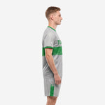 Custom grey speckle soccer uniform side view showing Kelly Green chest band and matching shorts stripe