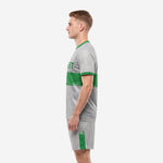 Men's gray soccer uniforms side view displaying full-dye sublimation speckle jersey and grey shorts with green trim