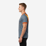 Custom grey and orange soccer training jersey showing spark-burst print on right shoulder, right side view on male model