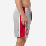 Grey soccer shorts showing full-length crimson red side panel with white contrast trim, left side view