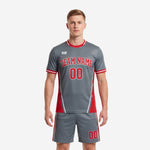 Custom grey and red sublimated soccer uniform kit front view with diagonal texture and arched team name