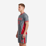 Right side view of grey and red soccer uniform kit with matching shorts and red side stripe