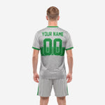Close detail of custom grey speckle soccer jersey with Kelly Green horizontal band and crew neck trim