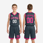 Back view of custom charcoal grey youth basketball uniforms with sublimated player name and number in white on the jersey