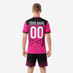 Custom hot pink soccer jersey with leopard print sublimation and black shoulder panel for team name personalization