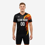 Custom logo training jersey in Jet Black with Neon Orange flame sublimation print, front view on male model
